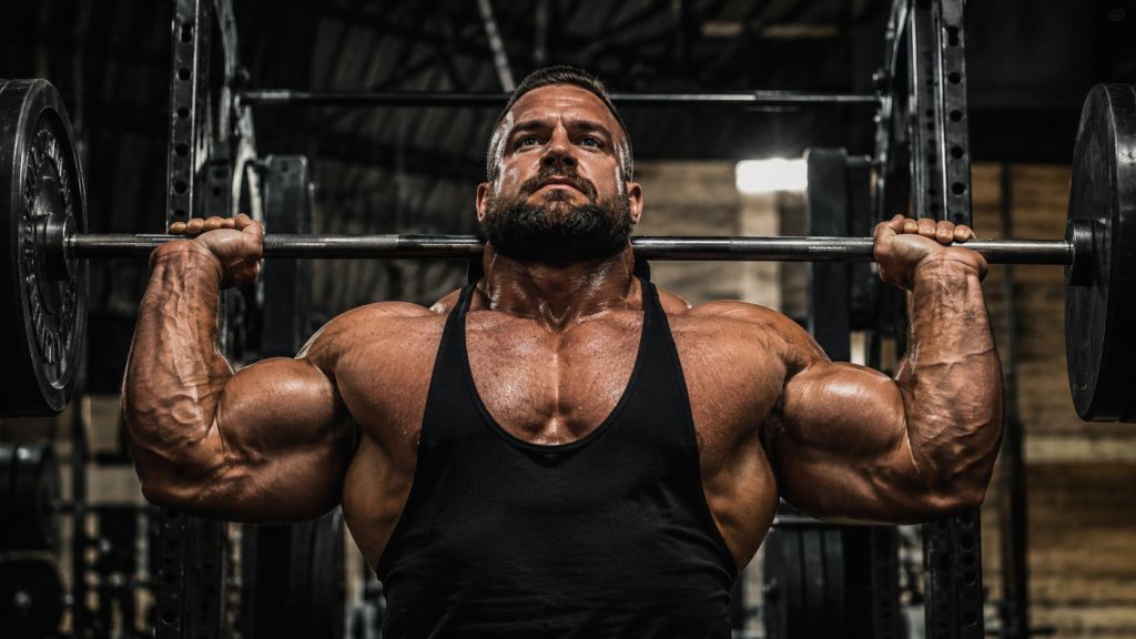 A massive bodybuilder displaying the incredible muscle thickness and heavy lifting power achieved during an authentic Ultima-Deca 500 cycle.